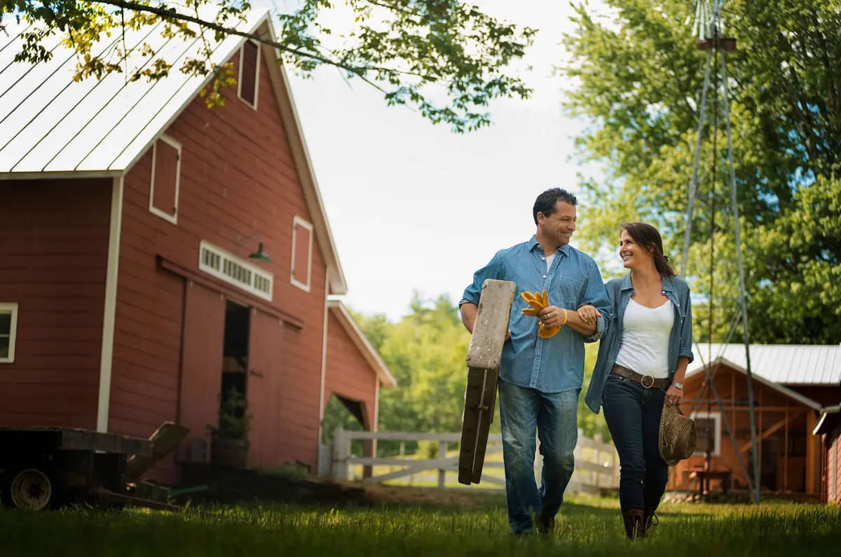Couple standing in the yard of a traditional home