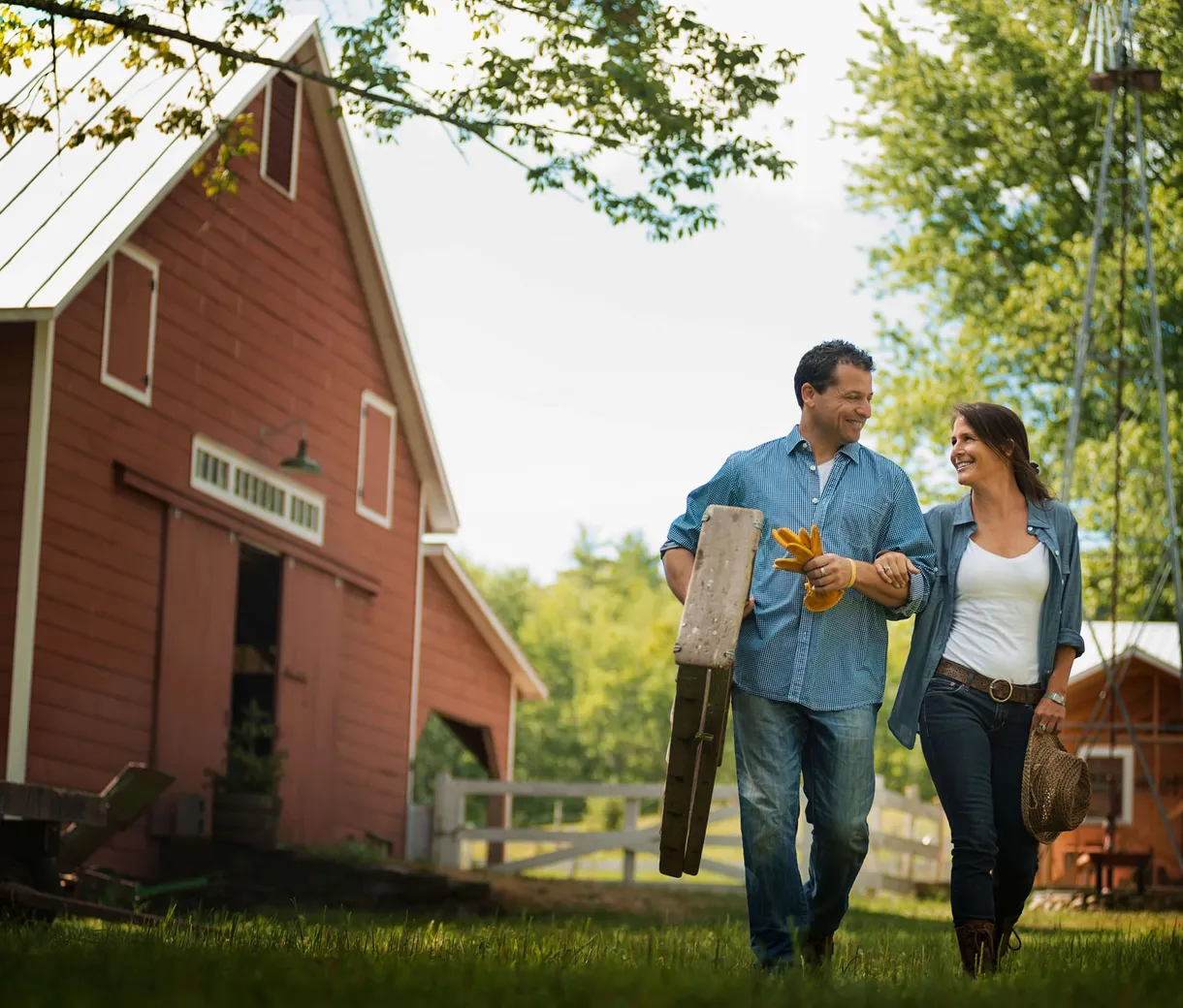 Couple standing in the yard of a traditional home