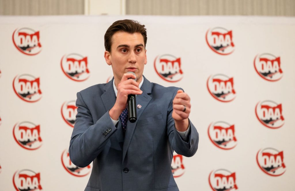 Man speaking with microphone at event