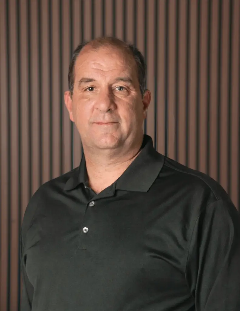 Man in black shirt with striped background