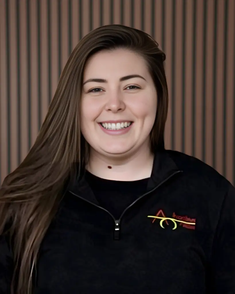 Smiling person in black jacket