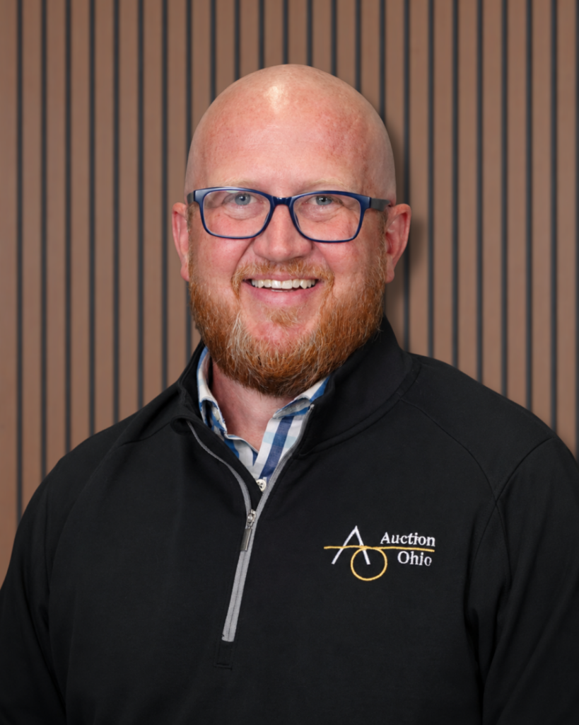 Smiling bald man with glasses, business portrait